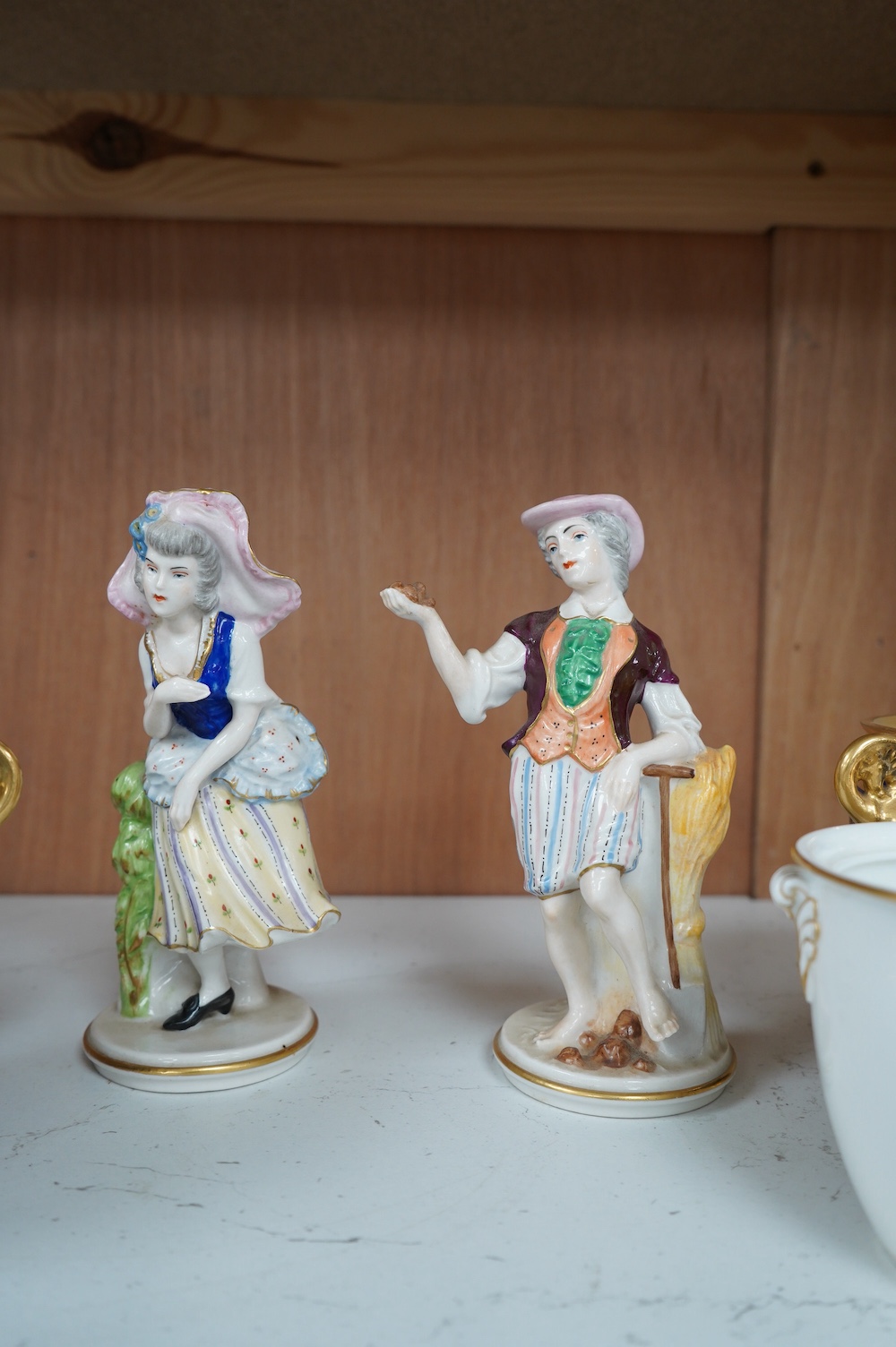 Capo di monte; a pair of figures, a pair of blue and gilt pots and a white and gilt Napoleonic monogrammed pot, tallest item 16.5cm high. Condition - fair